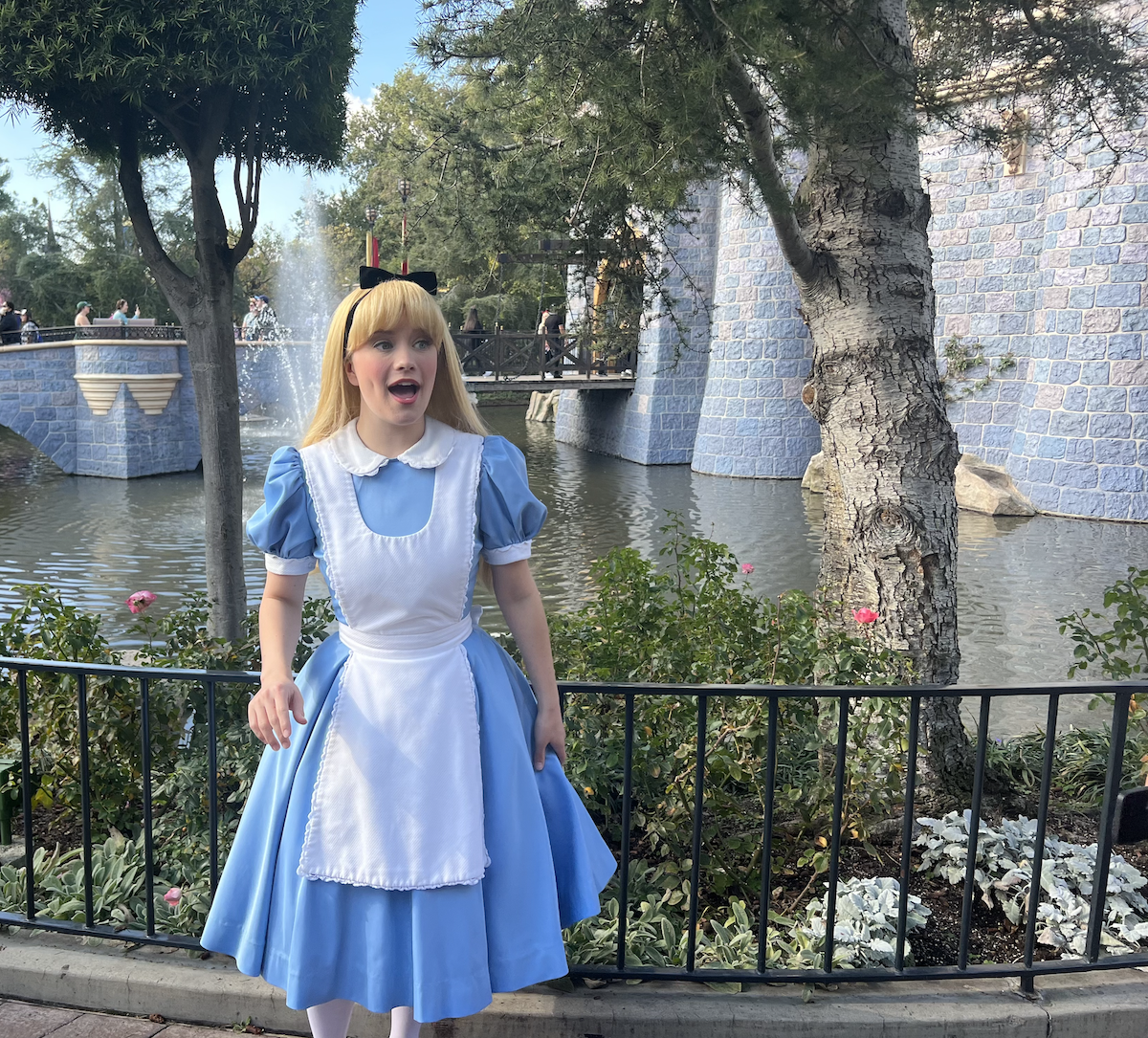 Alice at Disneyland by castle