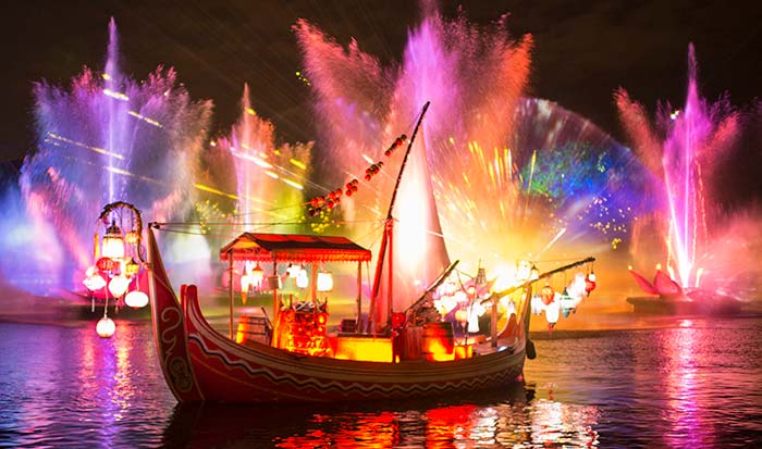 Boat going over water with colorful background