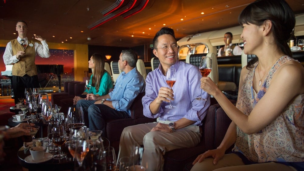 Adults toasting wine glasses