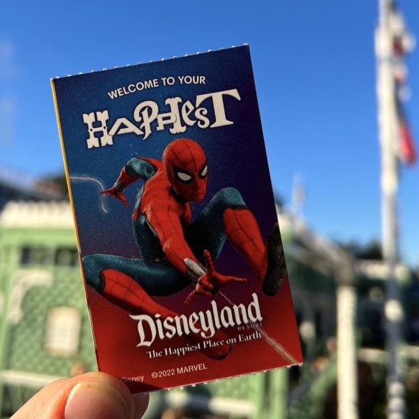 Spiderman ticket in front of Mark Twain Riverboat Disneyland