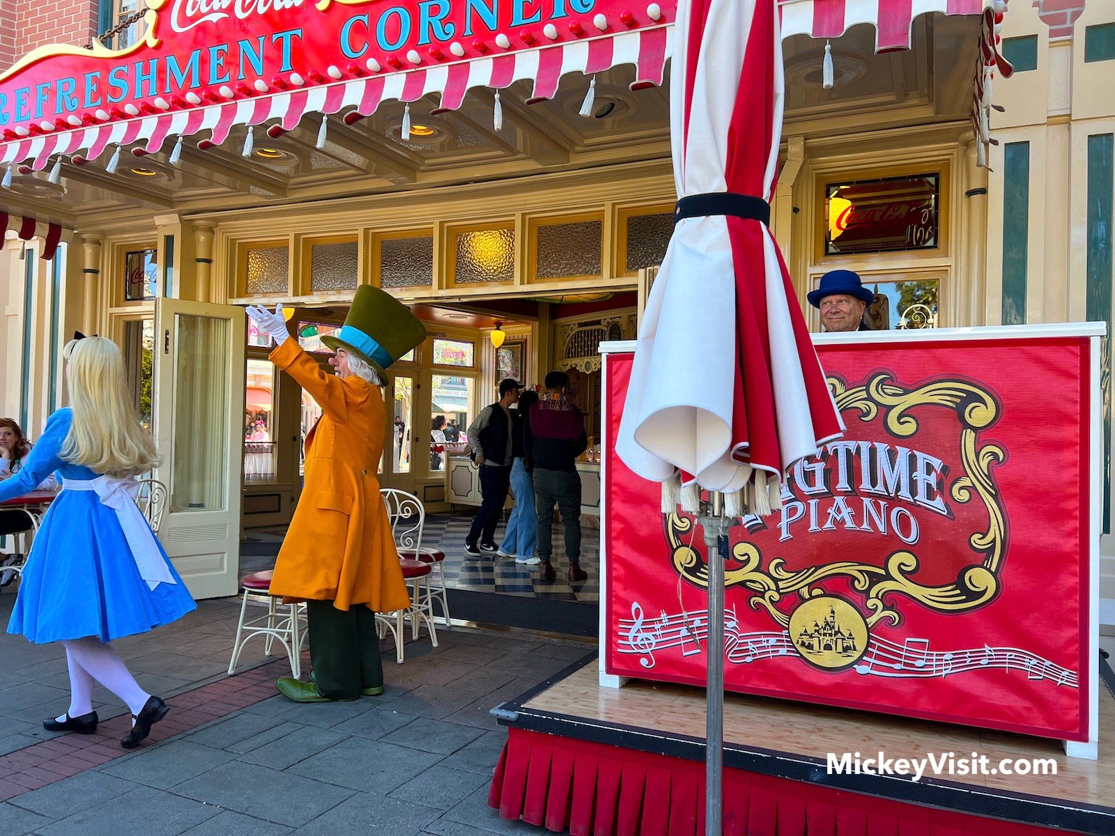 Alice and the Mad Hatter at Refreshment Corner