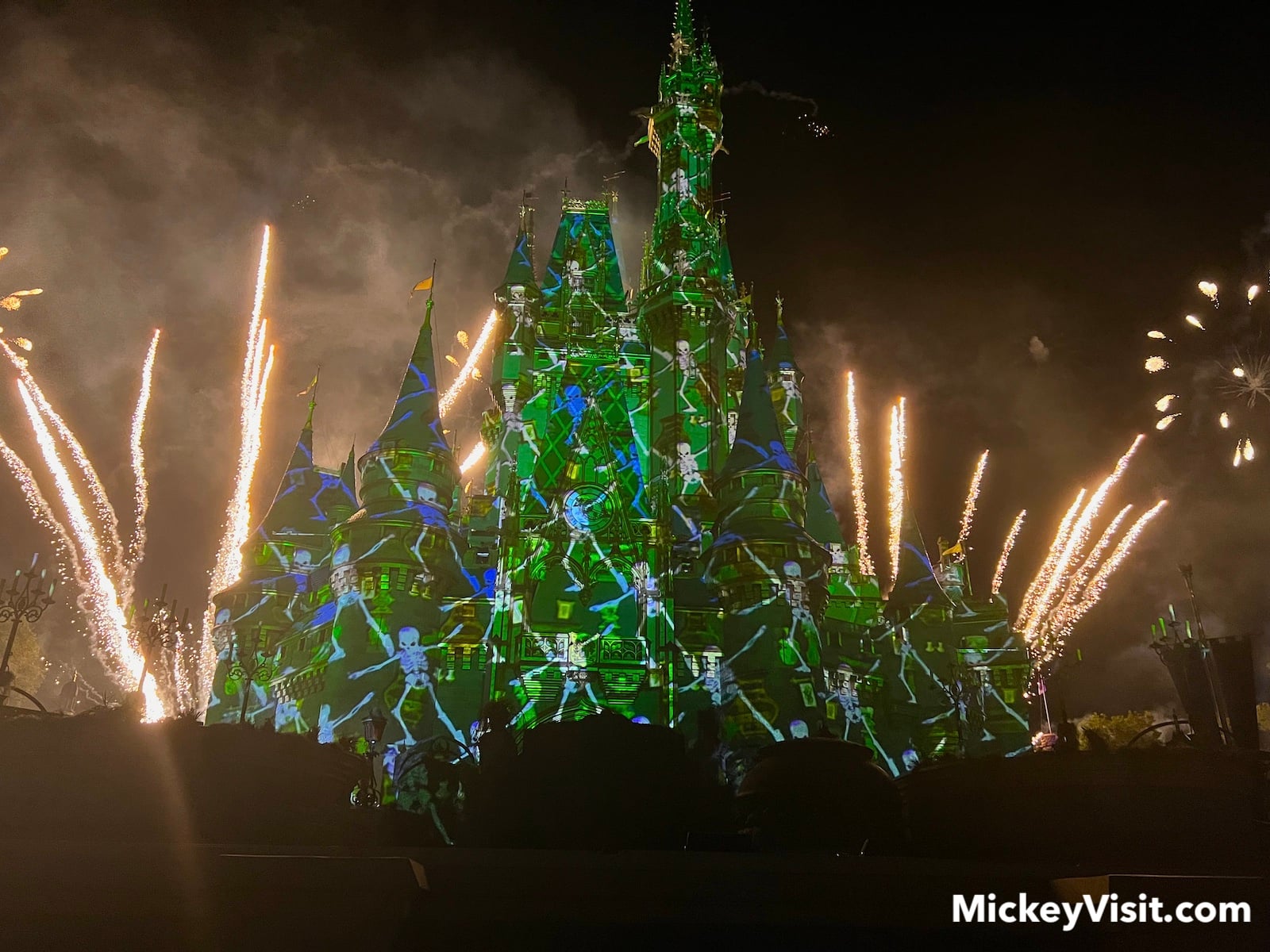 Castle with skeleton projections and fireworks