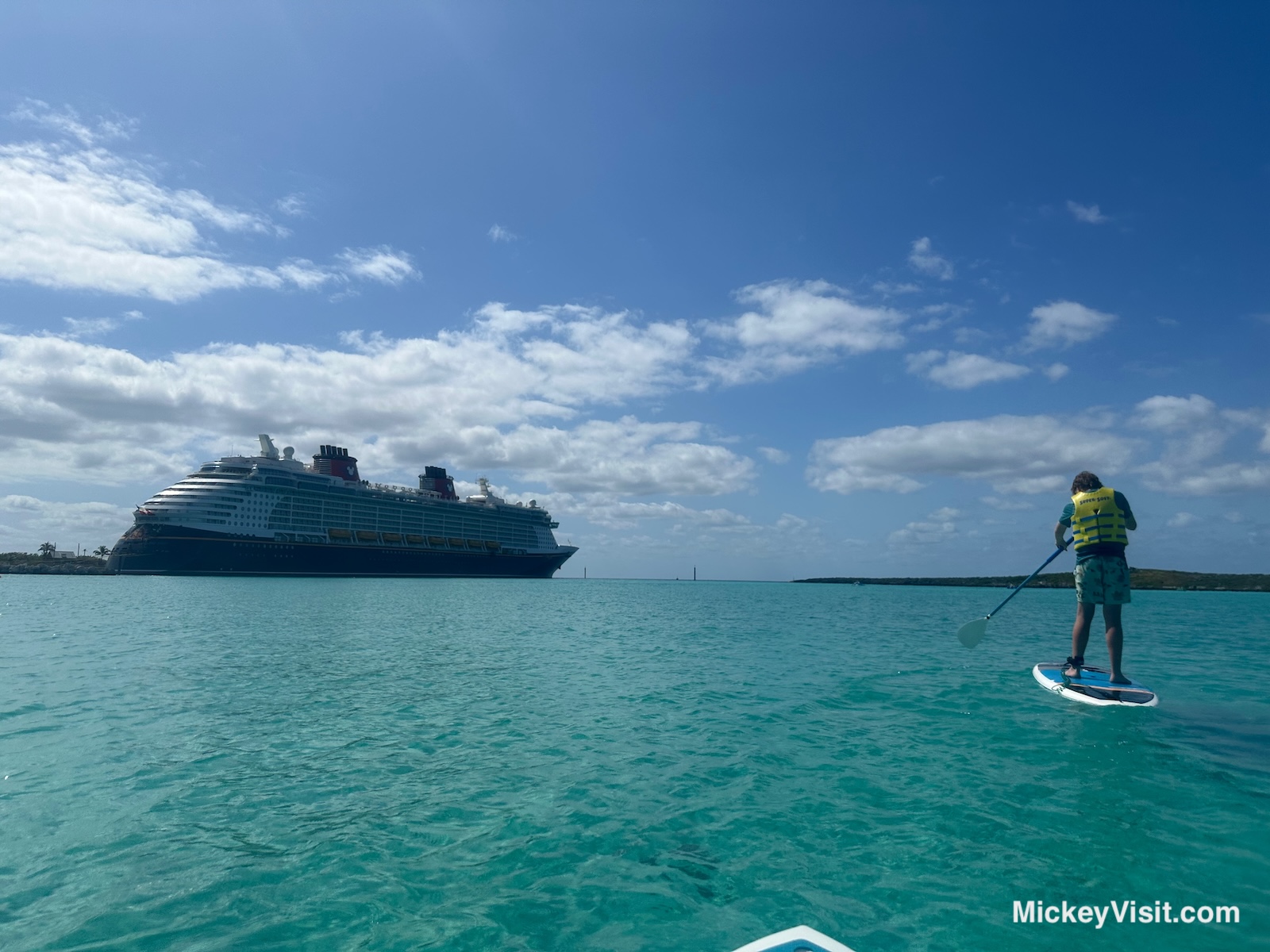 Paddleboarding in front of Disney Cruise ship