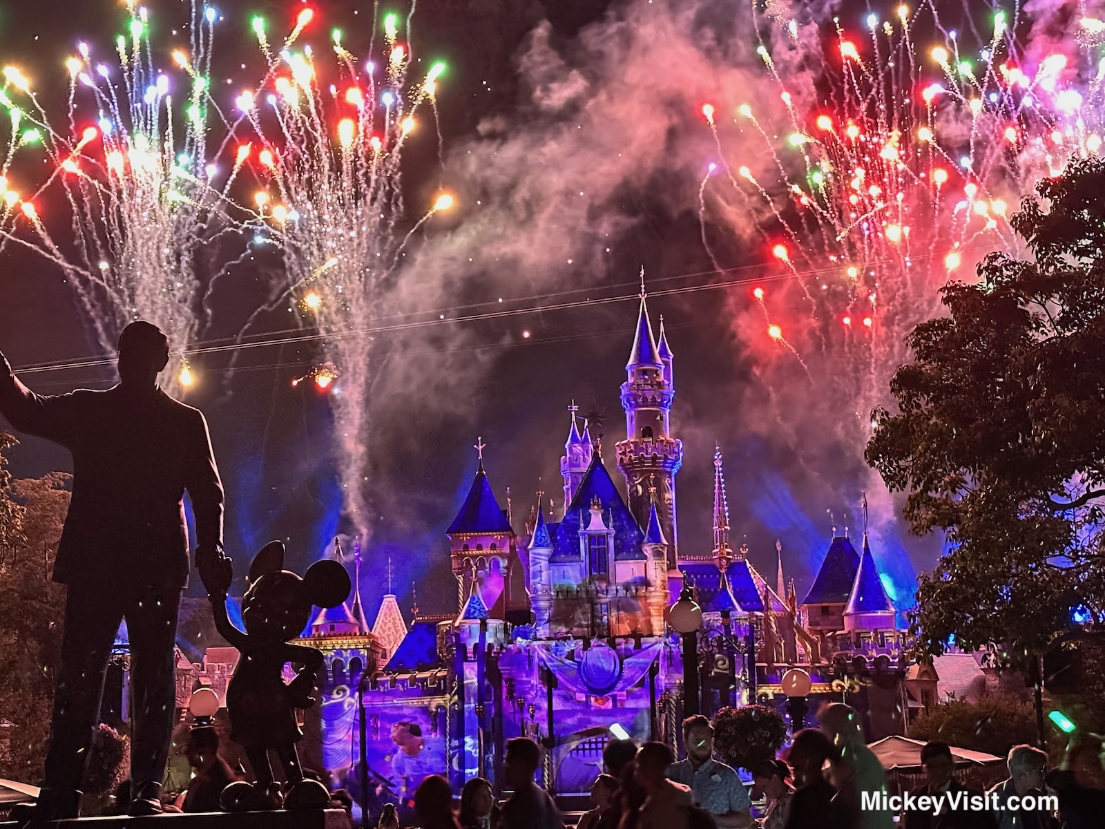 Walt Disney statue fireworks view