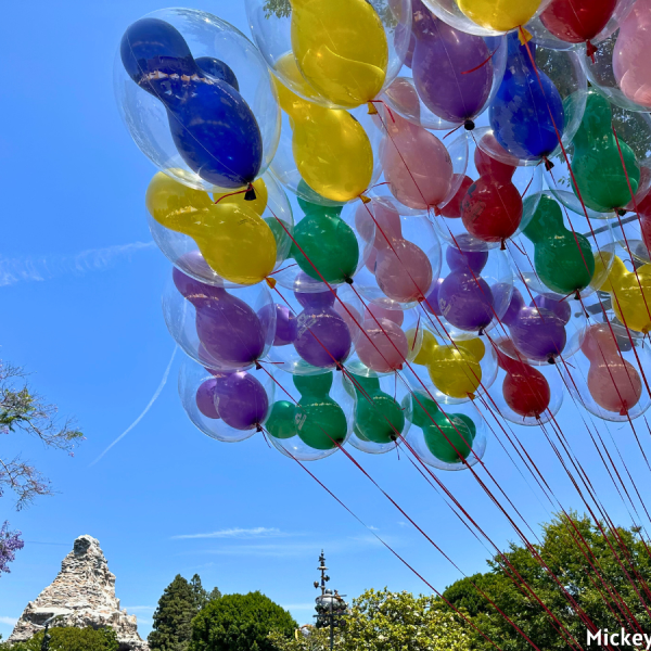 disneyland main street with balloons