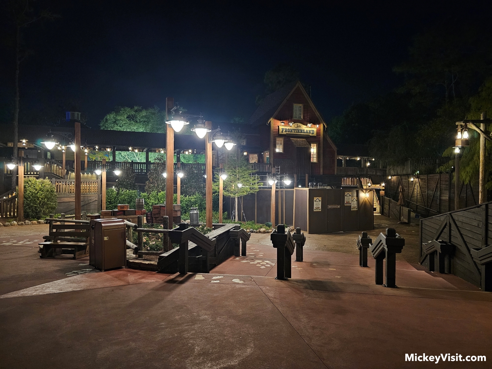 The nighttime lighting around the entrance to Tiana's Bayou Adventure at Magic Kingdom Park.