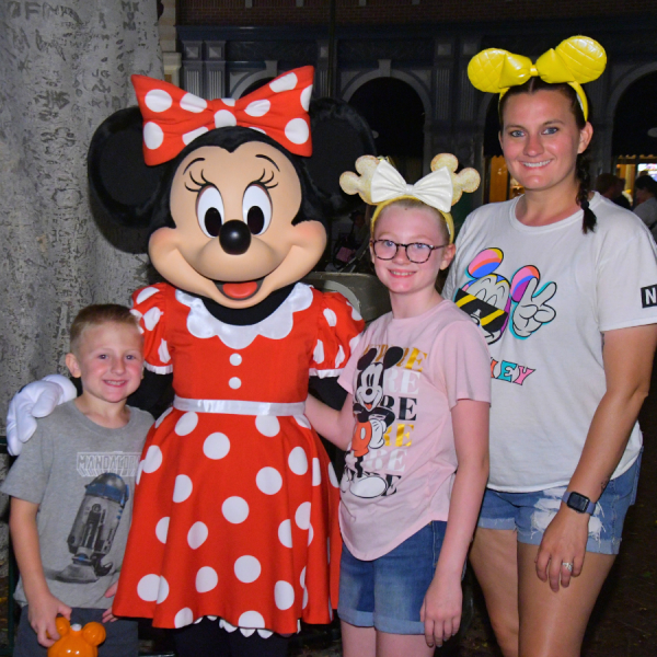 Family with Minnie Mouse at Disneyland