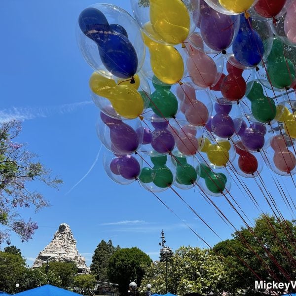 Disneyland balloons Matterhorn in background