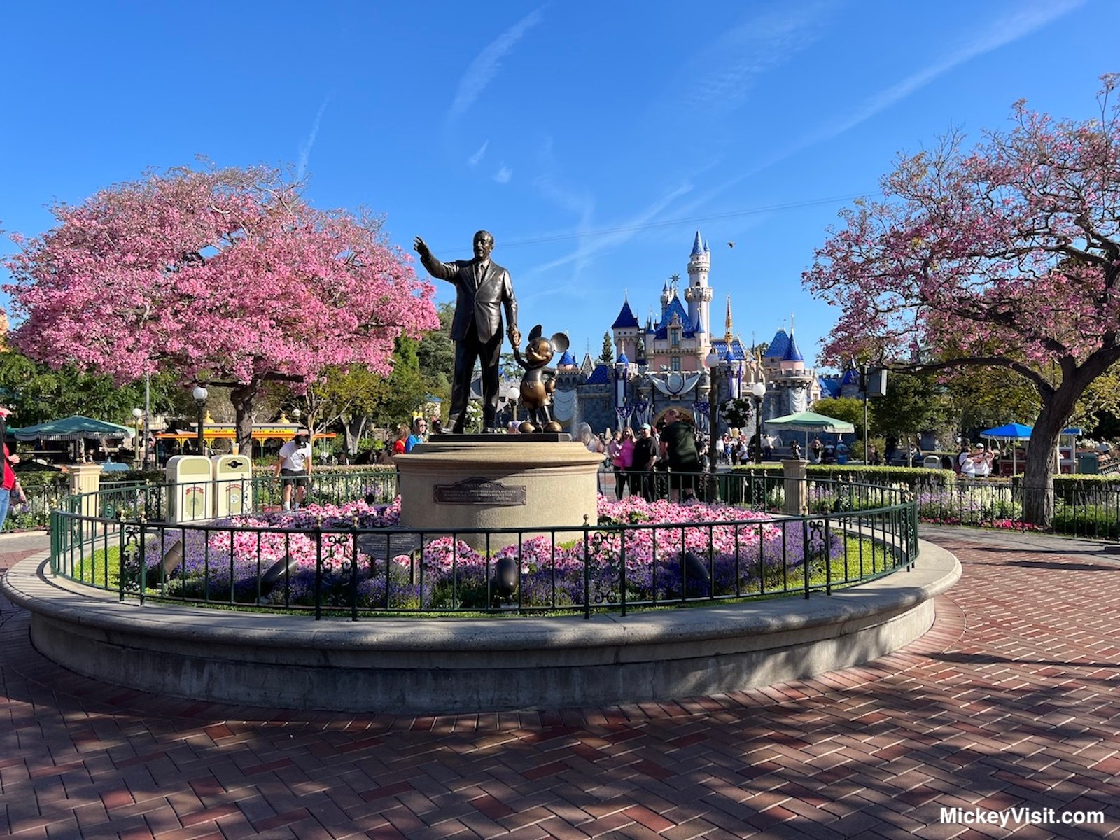 Disneyland partners statue in spring