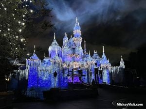 disneyland christmas snow covered sleeping beauty castle