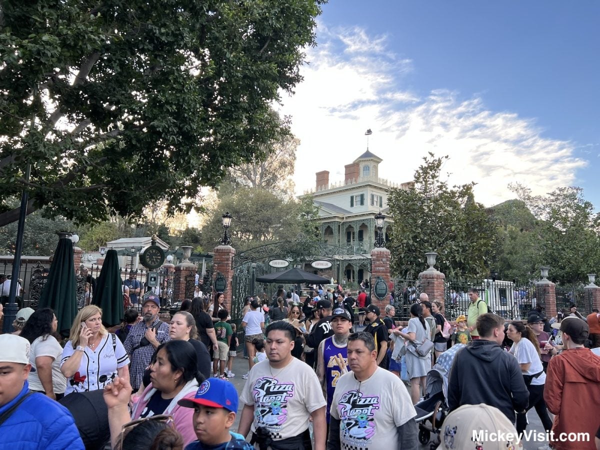 crowds at Disneyland Park in front of Haunted Mansion