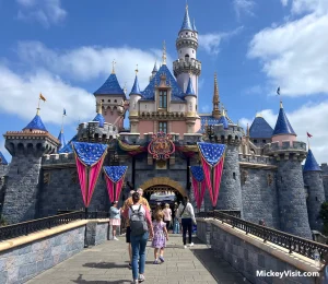 disneyland castle with 70th anniversary celebration decorations