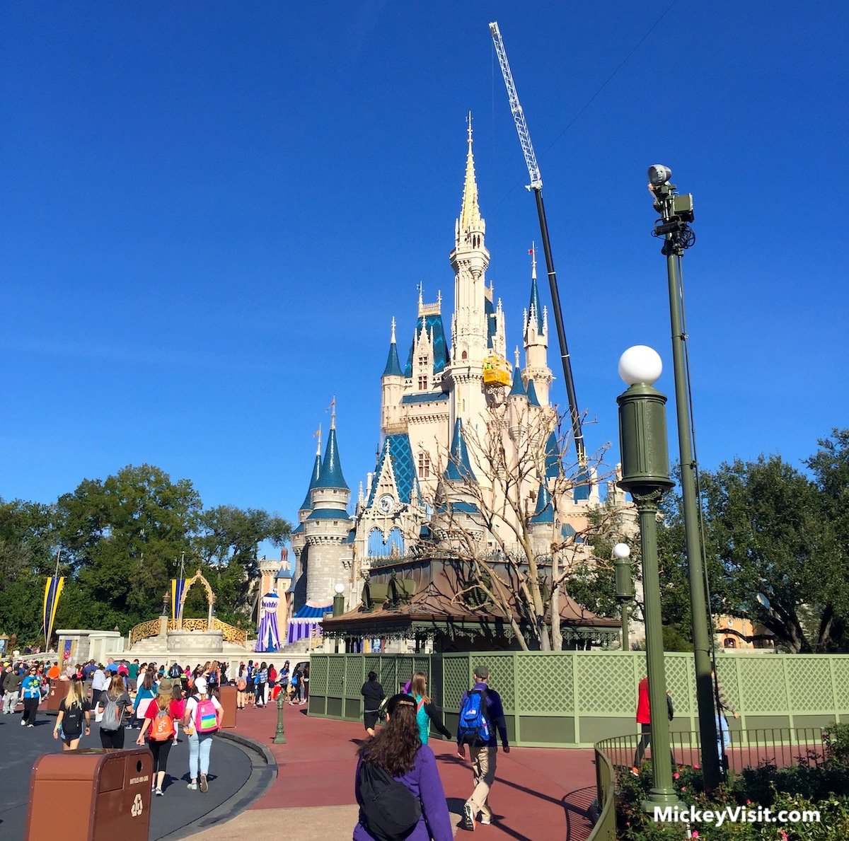 cinderella castle with crane in front of it walt disney world