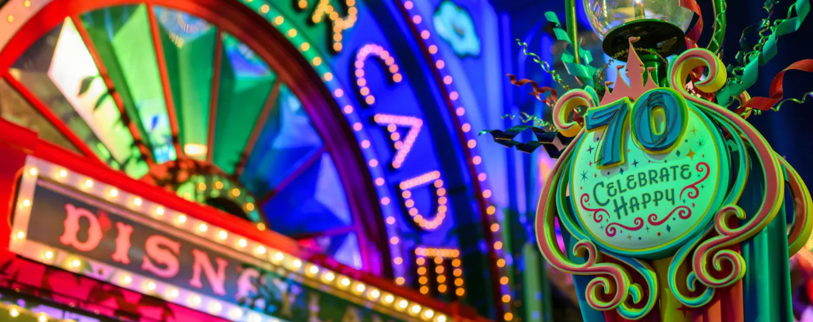 70th Disneyland anniversary sign in front of arcade
