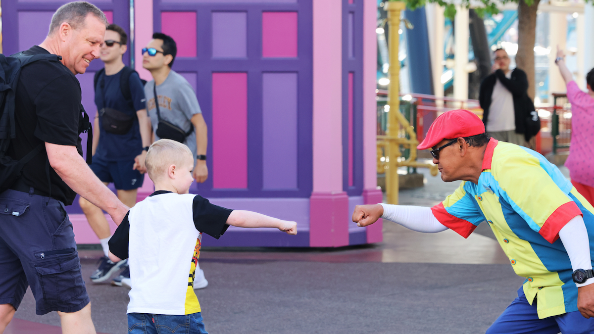 disney cast member fist bumping