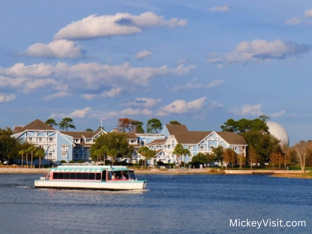 A Friendship Boat glides across Crescent Lake toward Disney's Beach Club Resort, with EPCOT's iconic Spaceship Earth peeking out in the distance