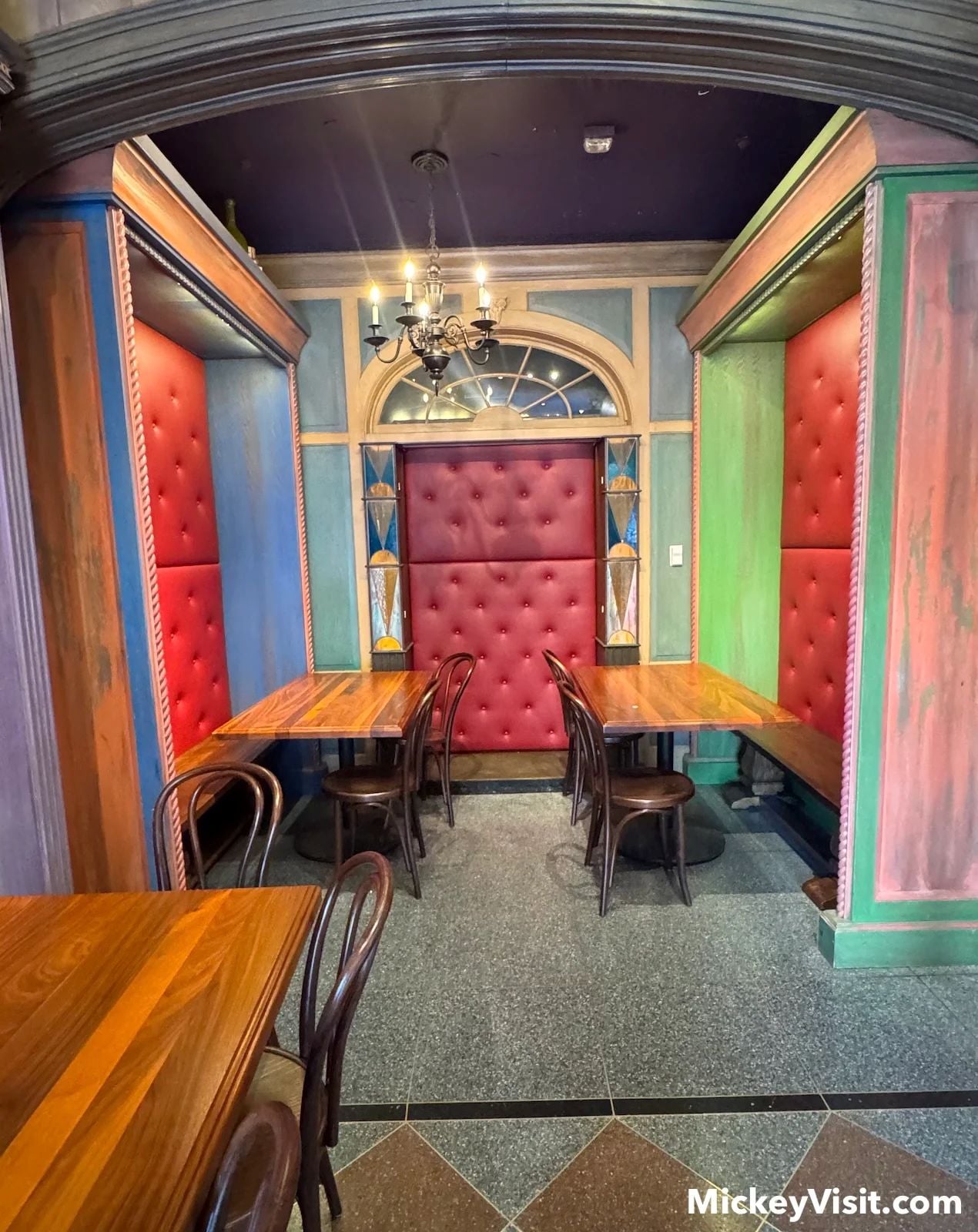 Tables and padded benches and walls at Disneyland seating area