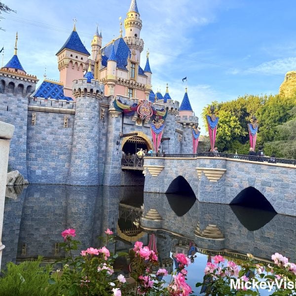 Disneyland Sleeping Beauty Castle with flowers and 70th anniversary decor