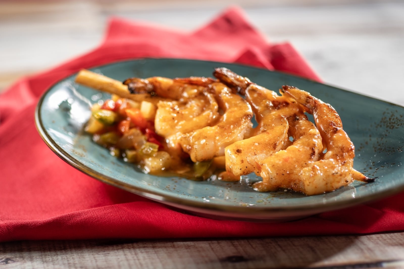 Grilled bushberry spiced shrimp skewer