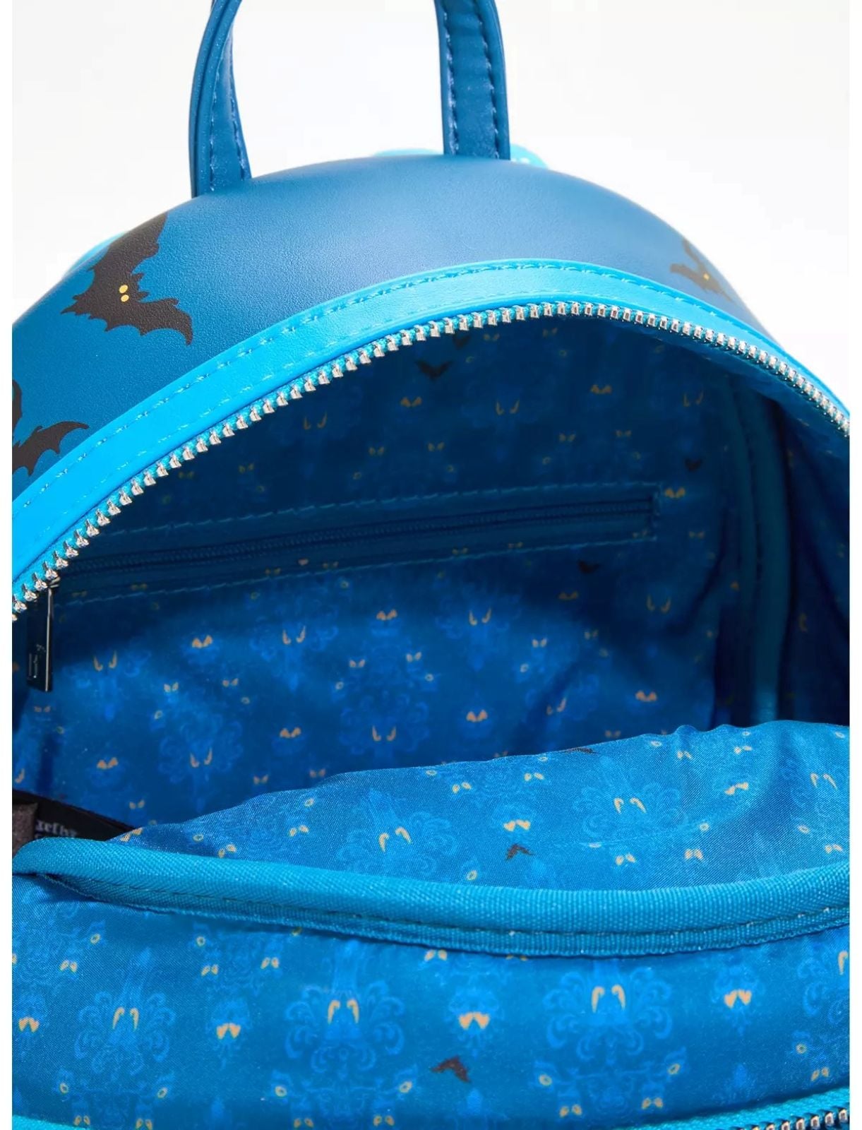 The eye-patterned inside lining for Haunted Mansion inspired Loungefly bag