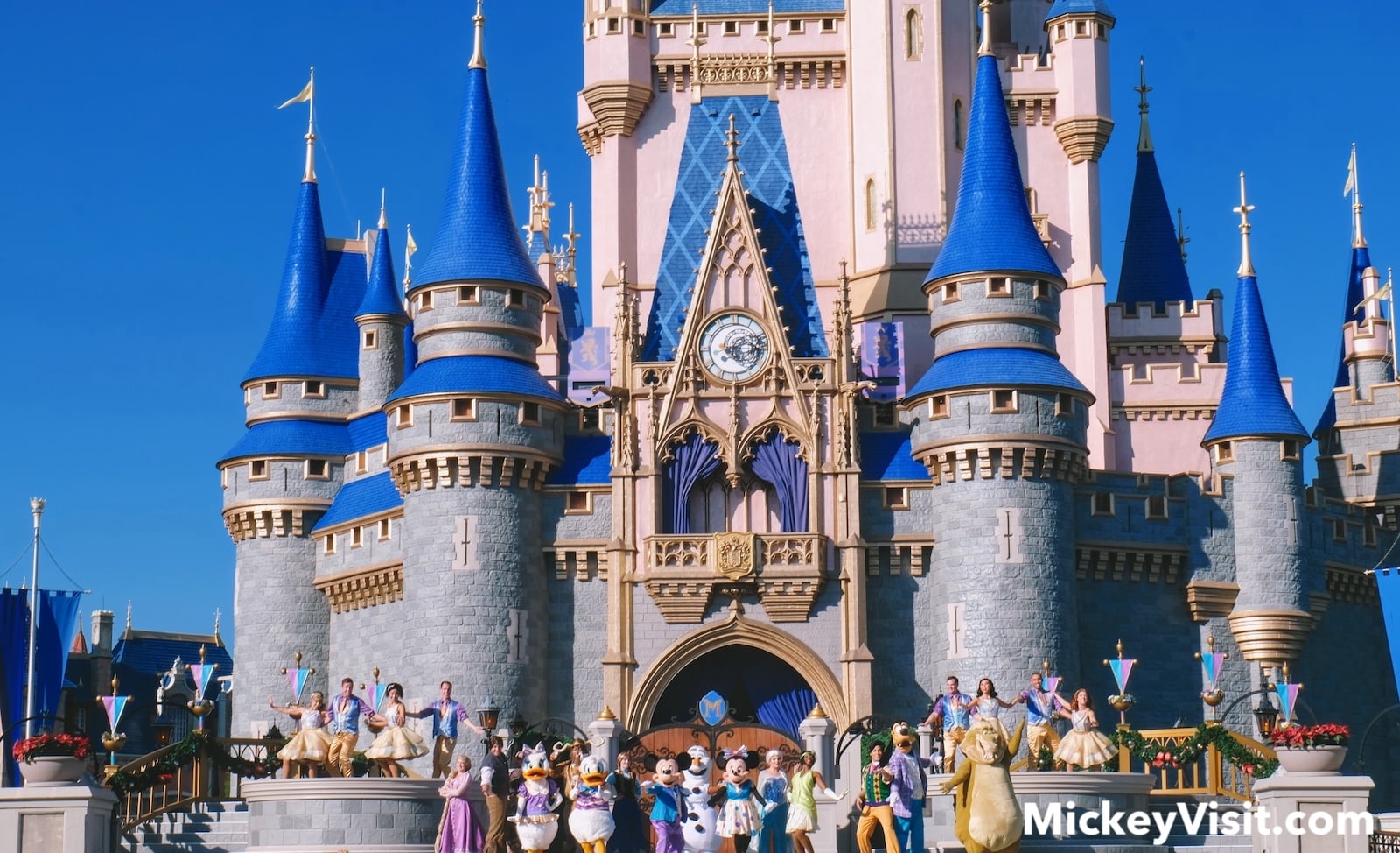 Disney characters in front of castle