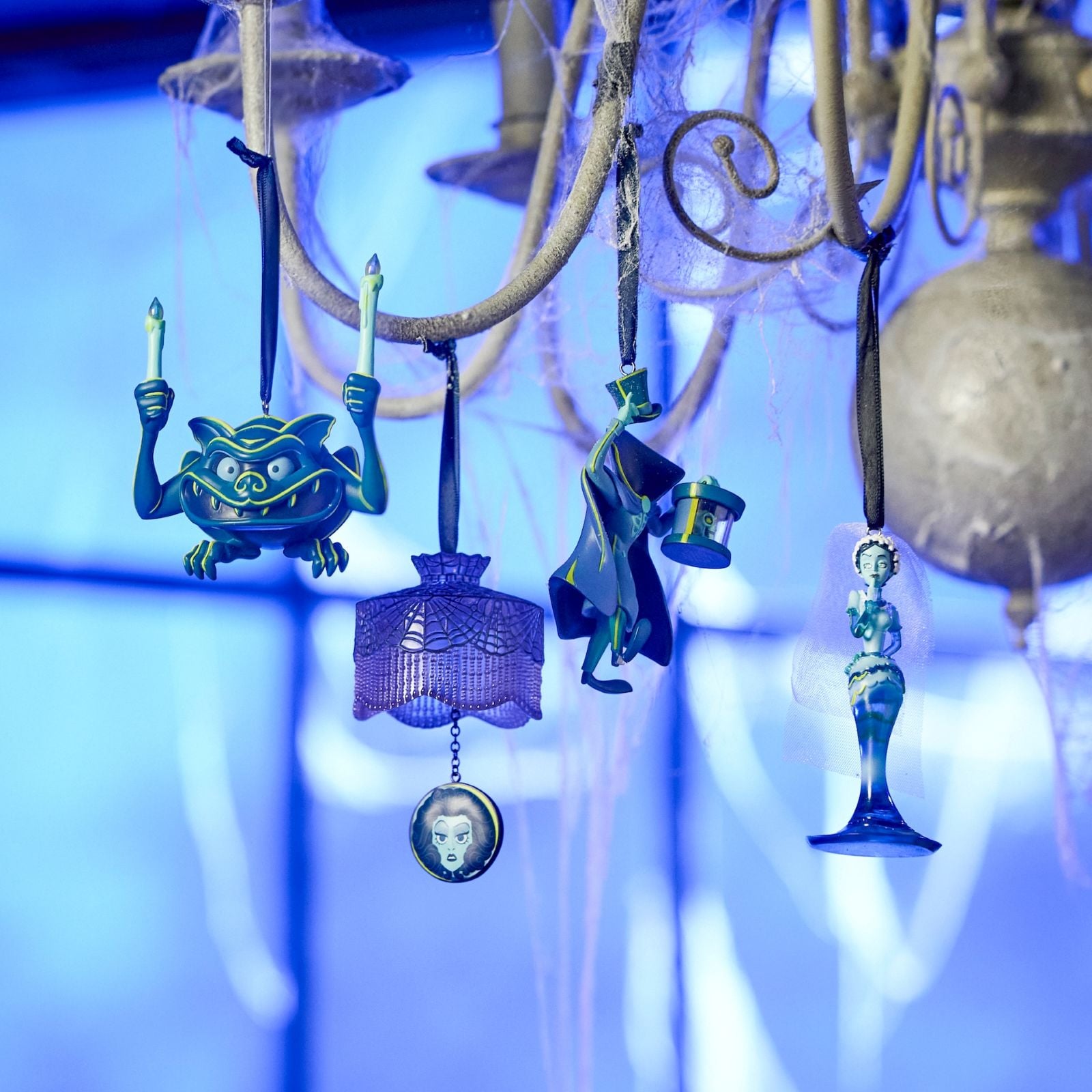 Four different Haunted Mansion ornaments