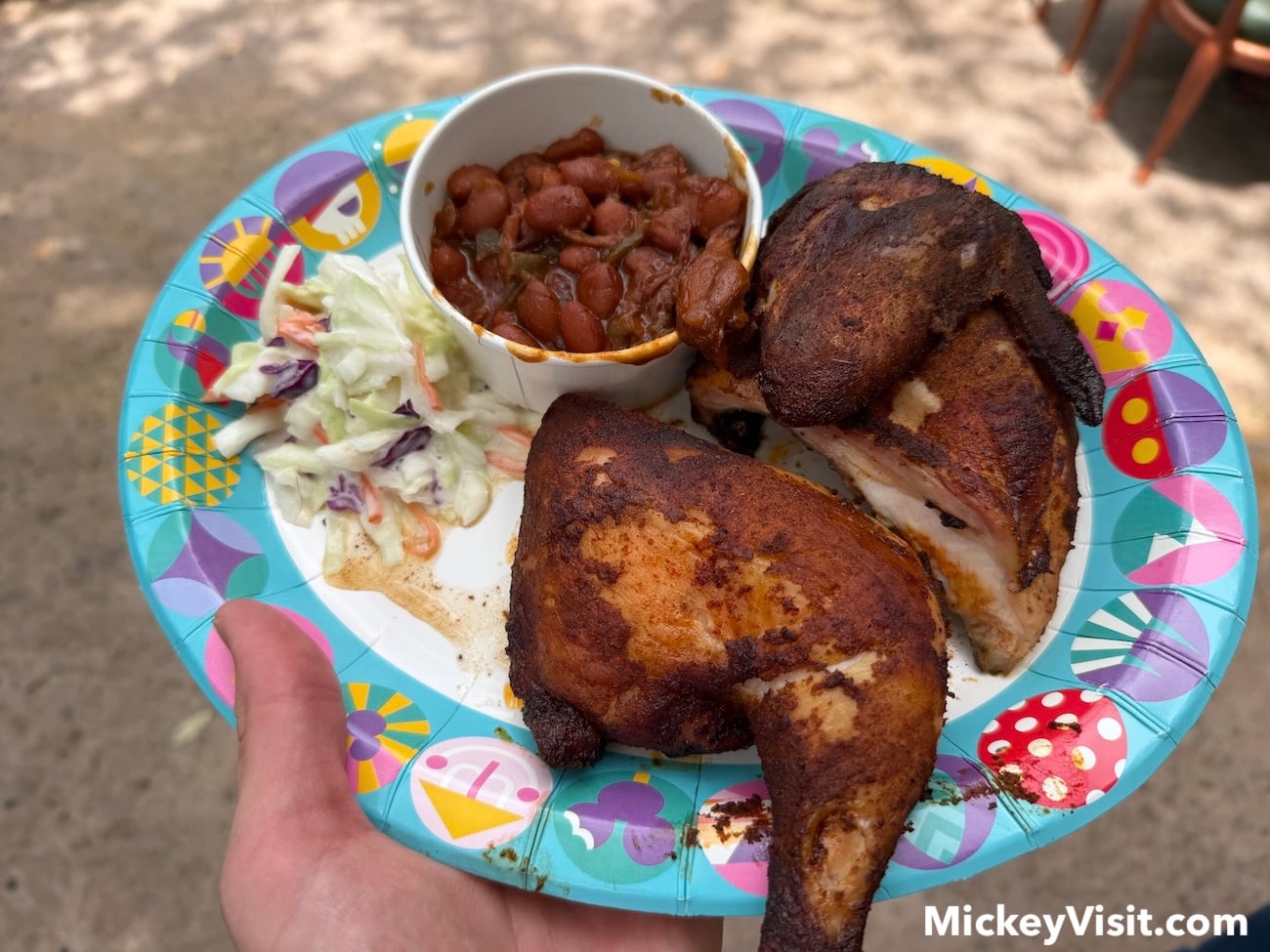 Half chicken, beans, and coleslaw