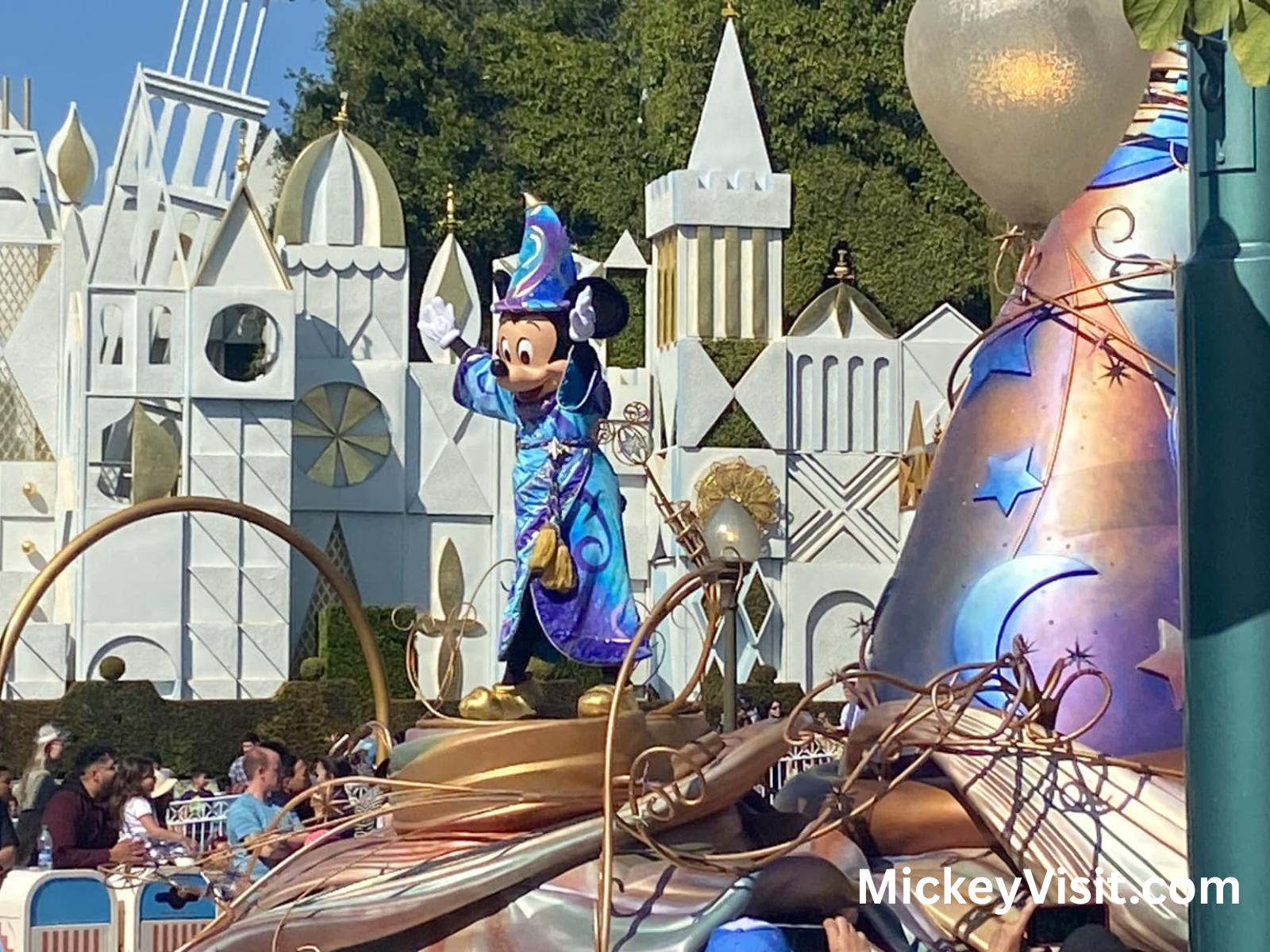 Sorcerer Mickey on a parade float outside Its A Small World