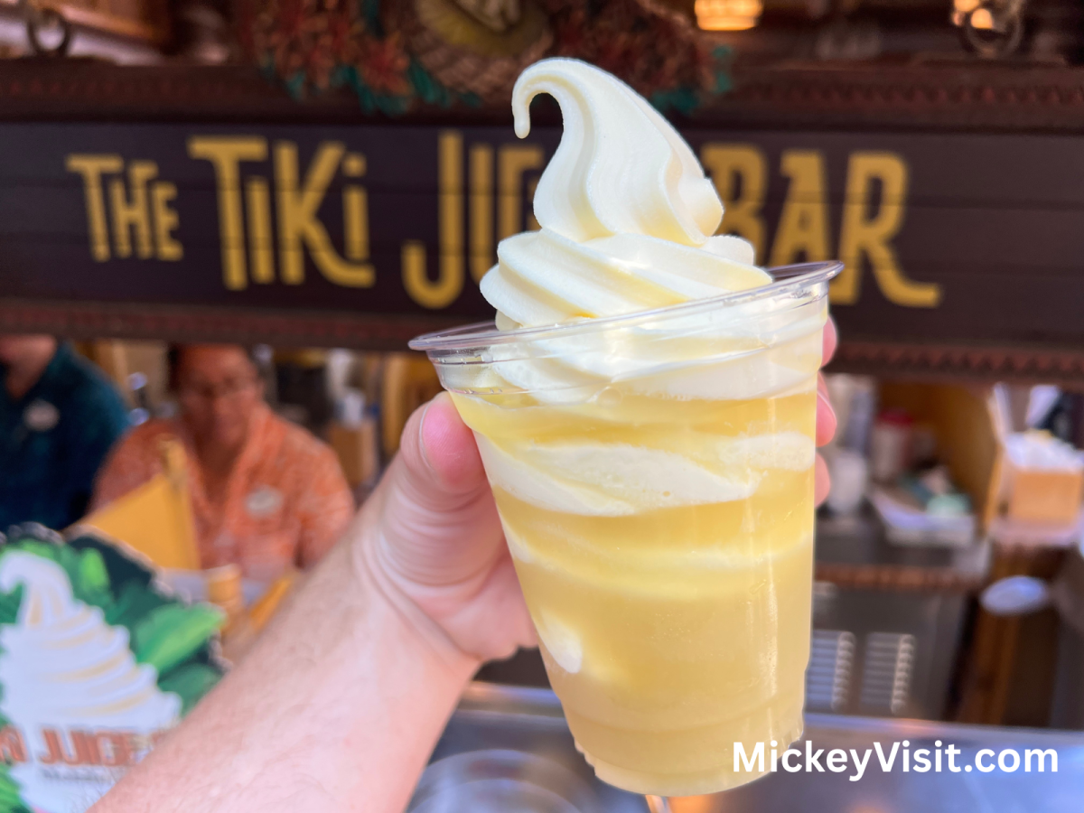 Dole Whip in front of wooden tiki sign