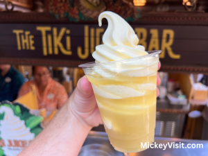 Dole Whip in front of wooden tiki sign