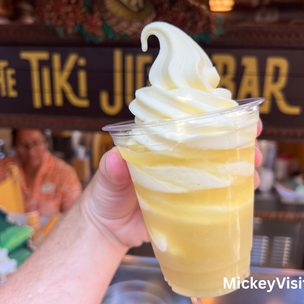 Dole Whip in front of wooden tiki sign