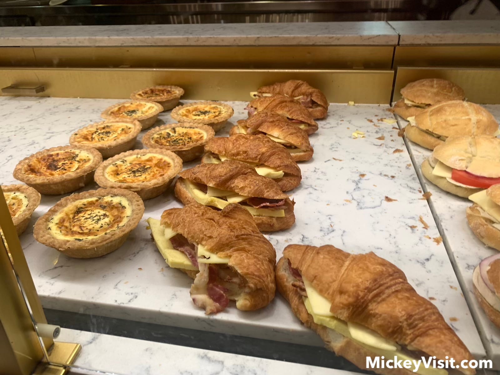 Croissant and quiche in display case