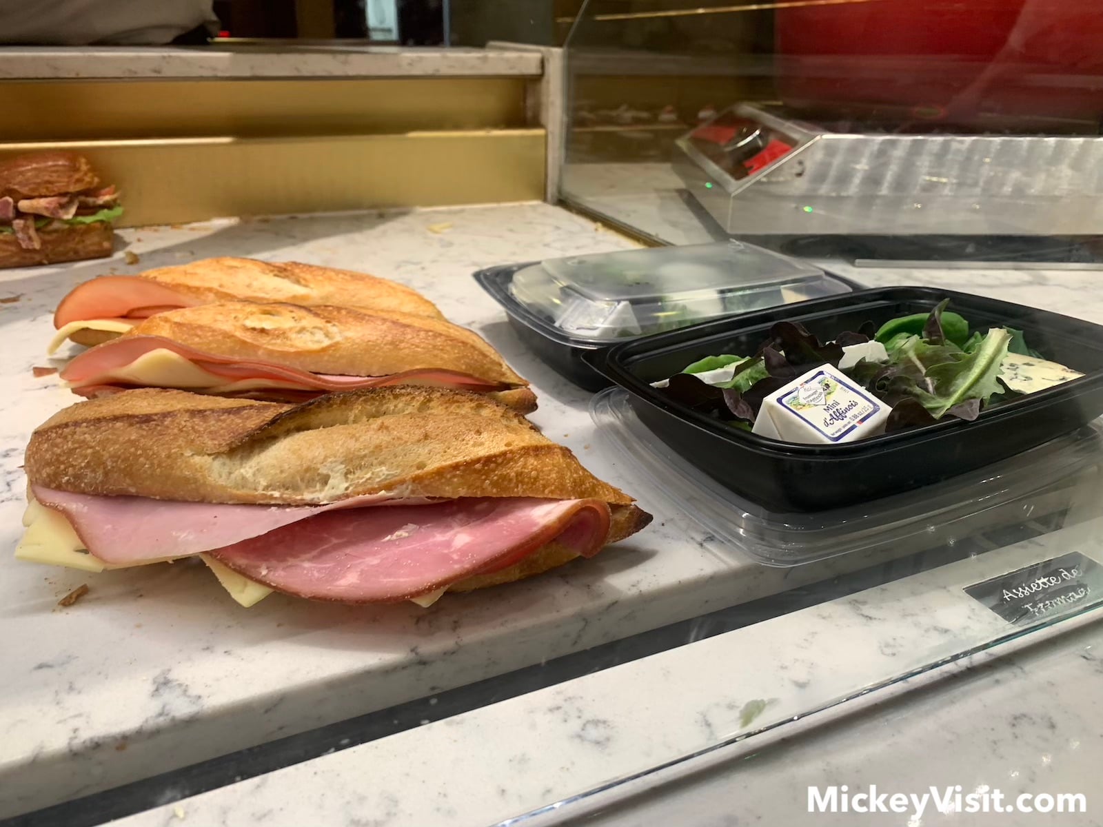 Sandwich and salad in display case