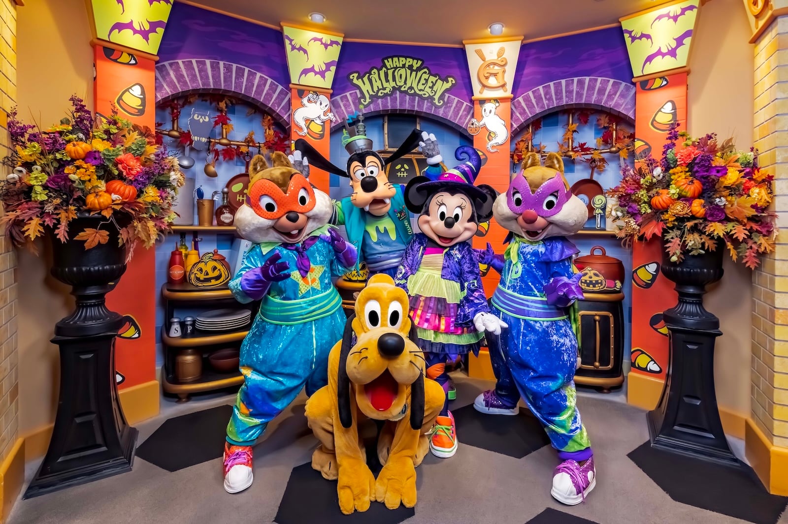Disney characters in Halloween outfits