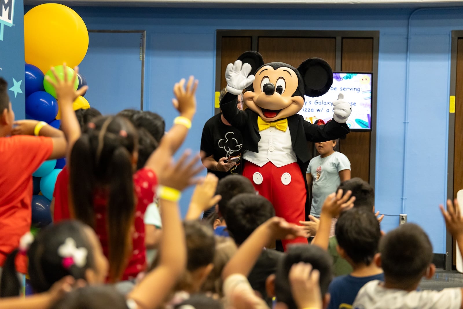 Mickey Mouse visiting kids