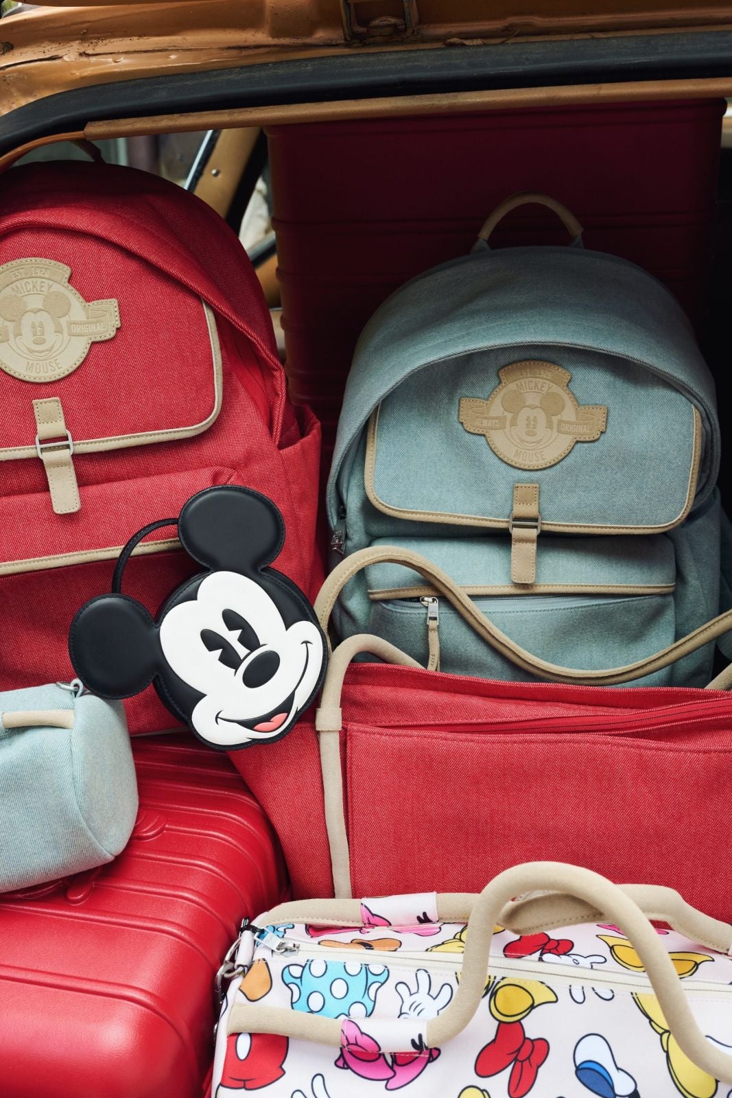Assortment of bags and backpacks from the Disney x Beis collection