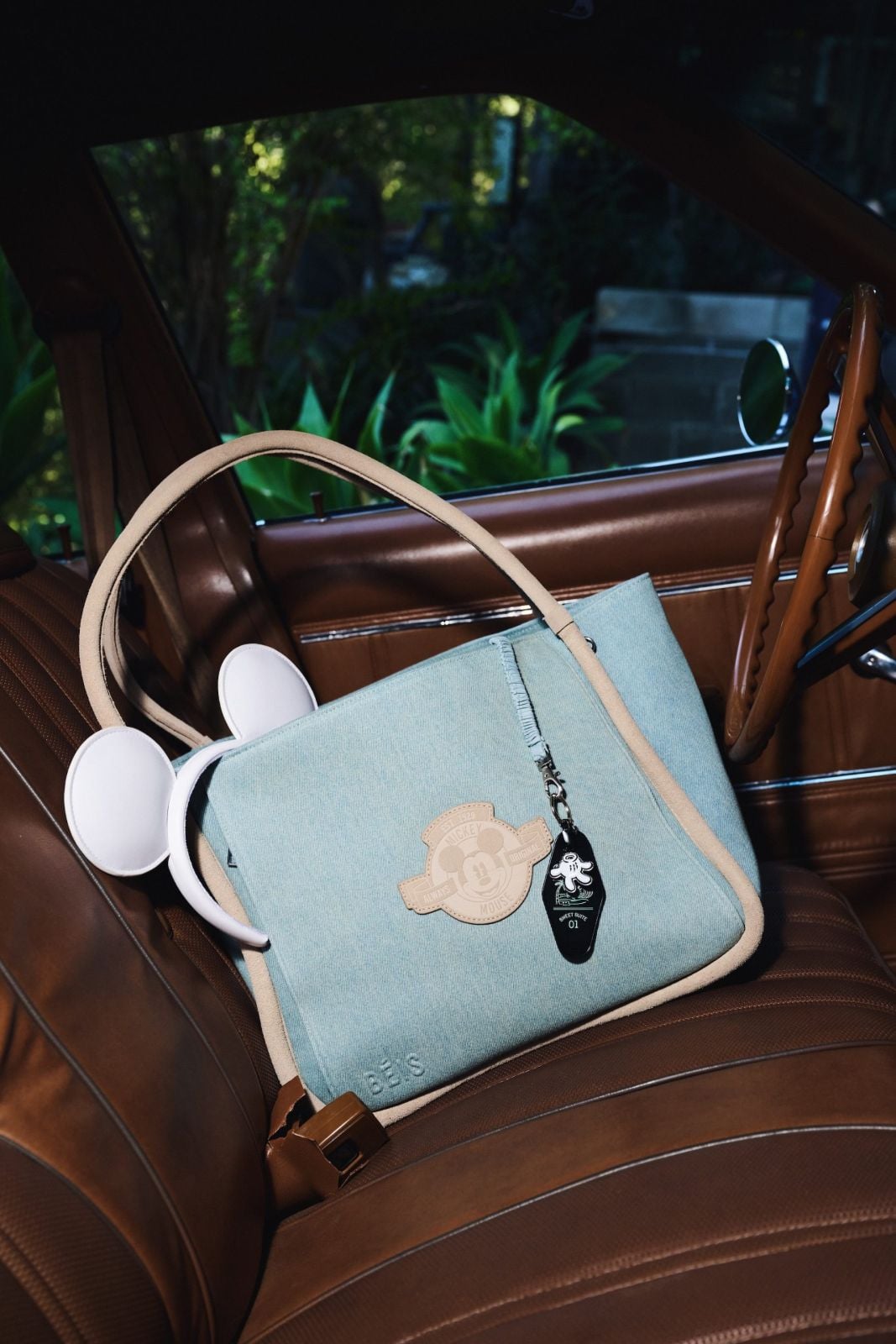 Blue tote bag in a car seat