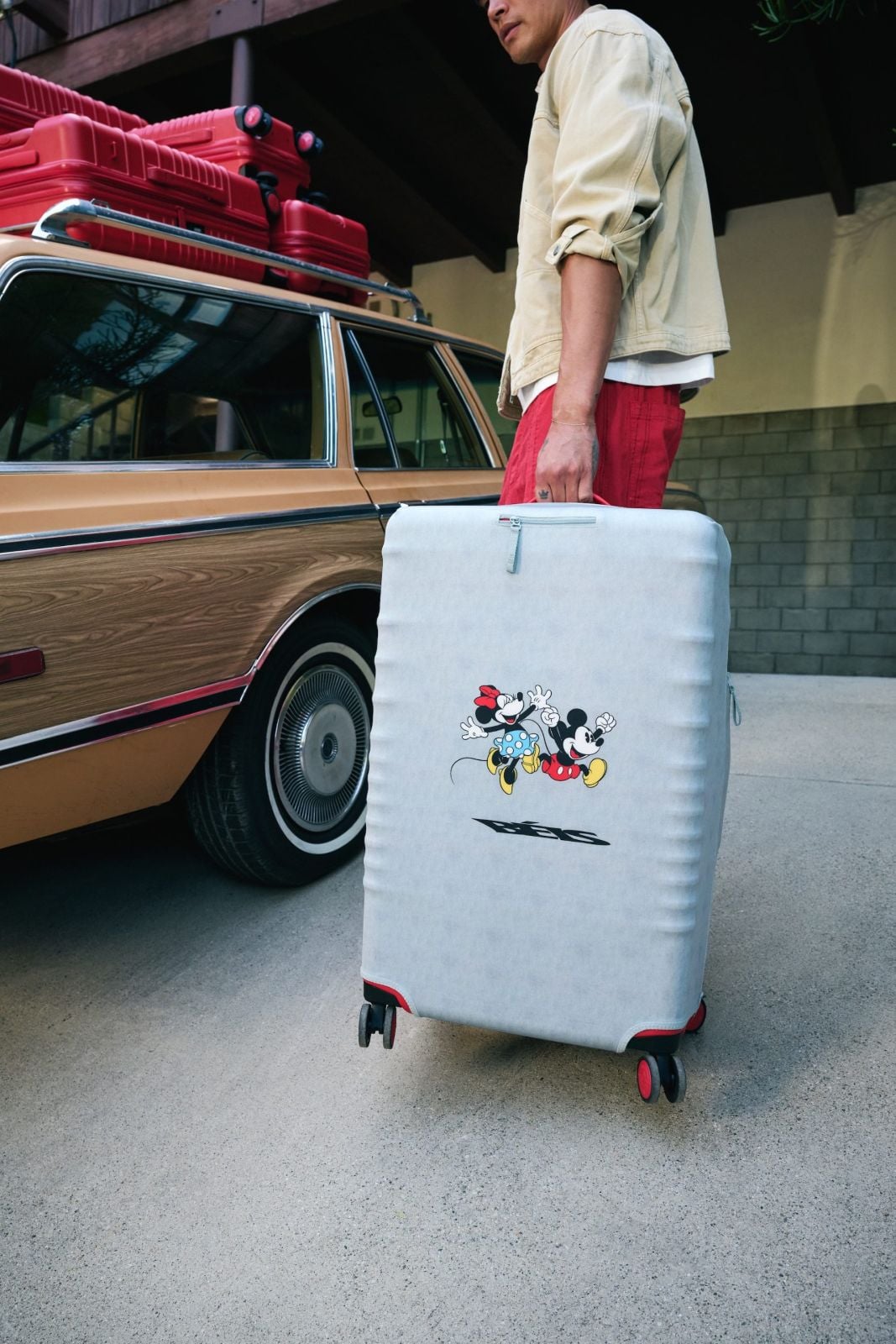 Blue luggage cover with Mickey and Minnie