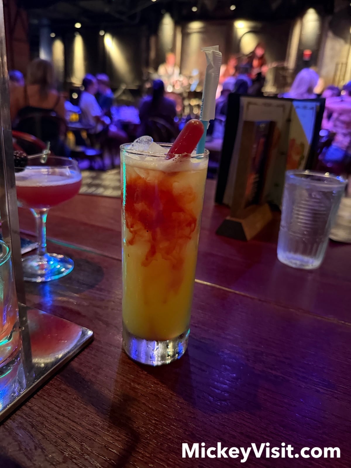 Yellow drink with red drop