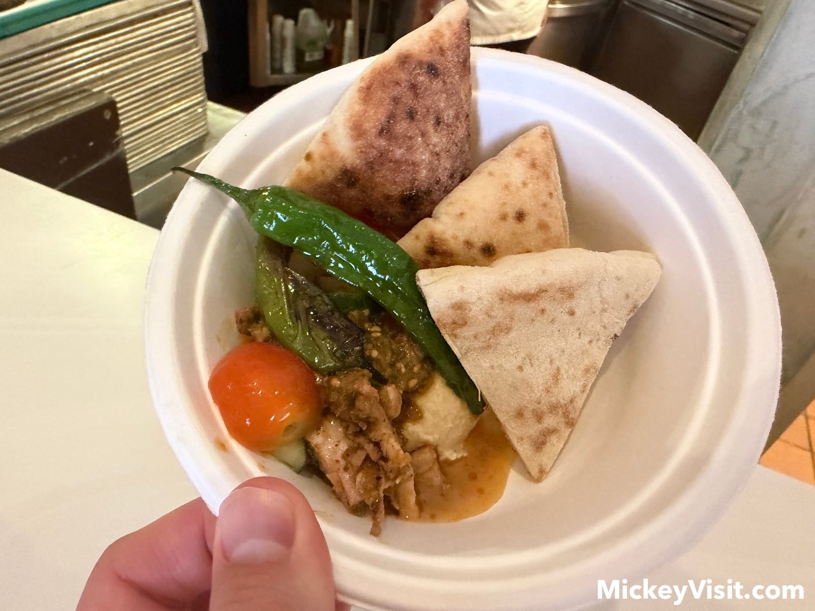 Chicken hummus bowl with pita bread