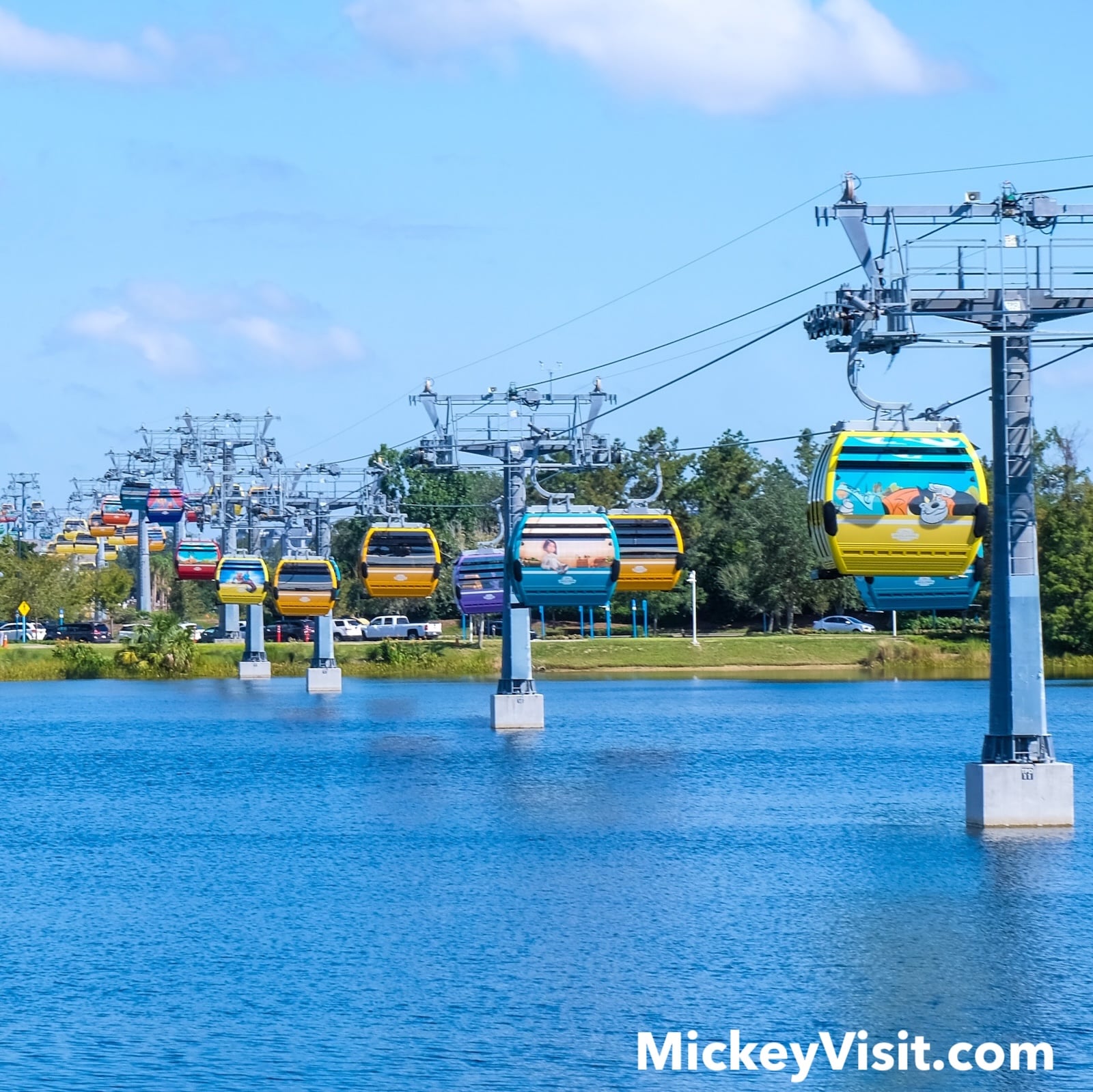Gondolas over blue lake