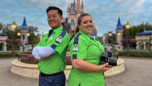 PhotoPass Cast Members in front of Magic Kingdom Cinderella Castle