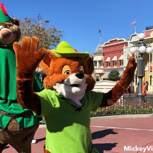 Little John and Robin Hood characters waving