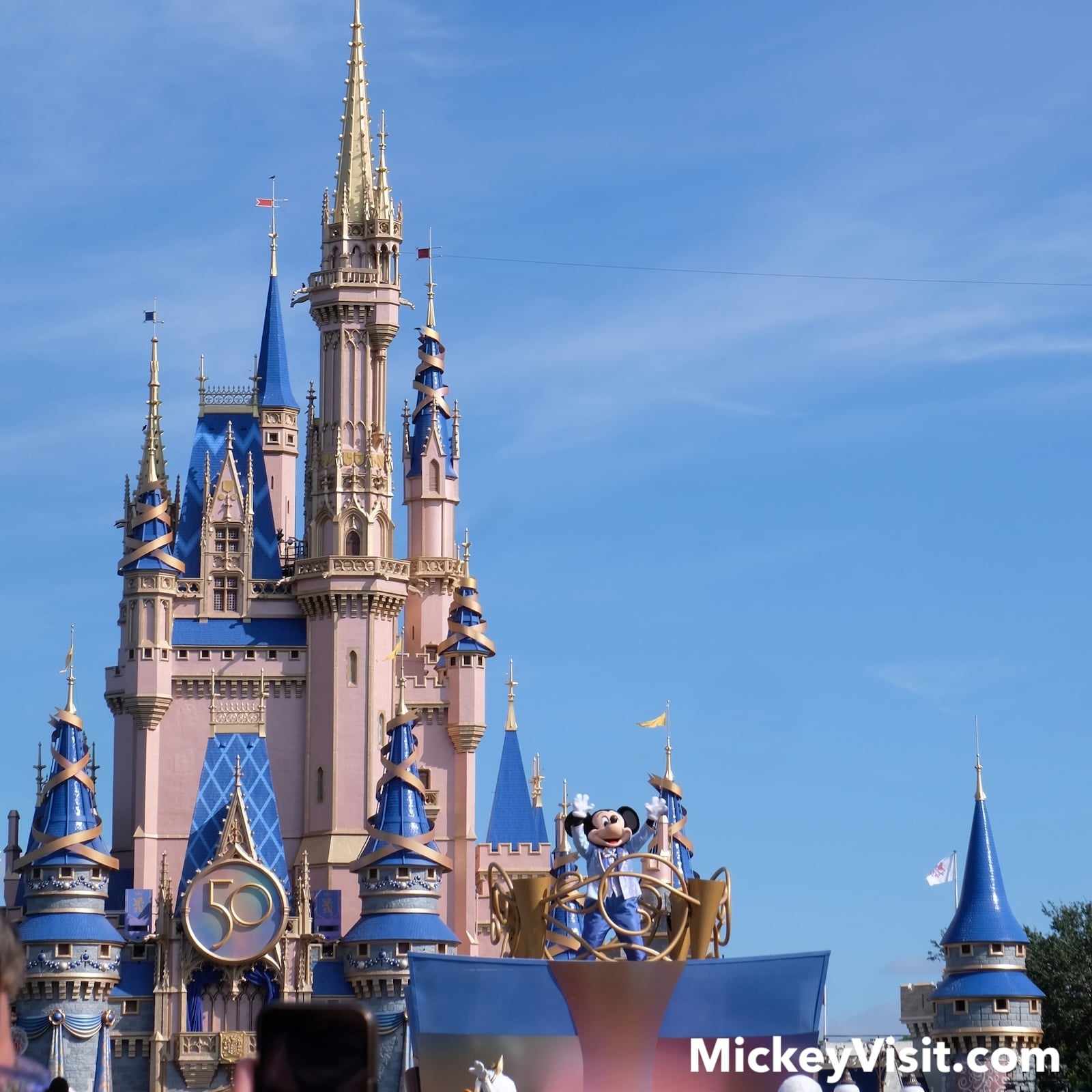 Mickey Mouse in front of Cinderella Castle