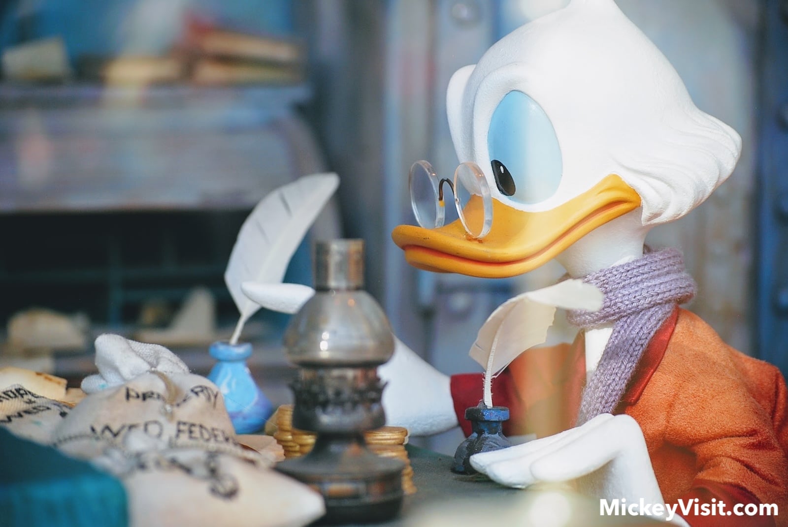 Scrooge McDuck statue with money coins
