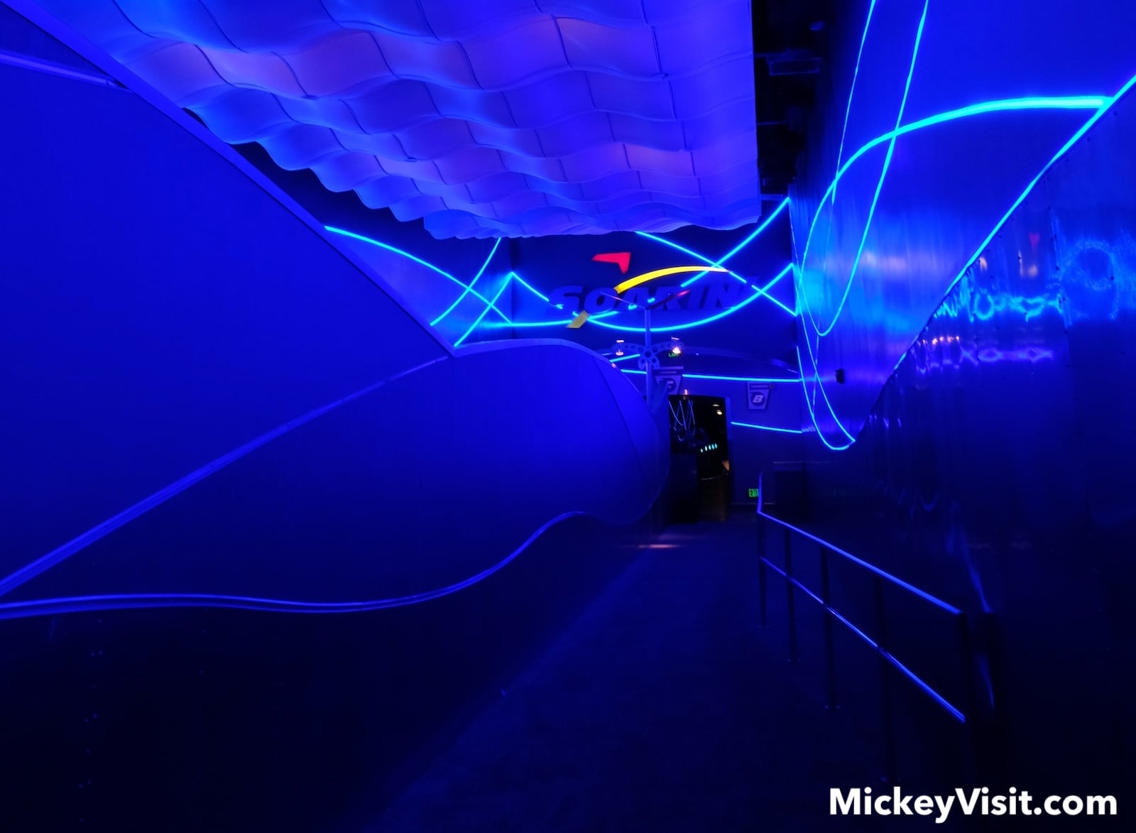 Empty ride queue in blue neon room