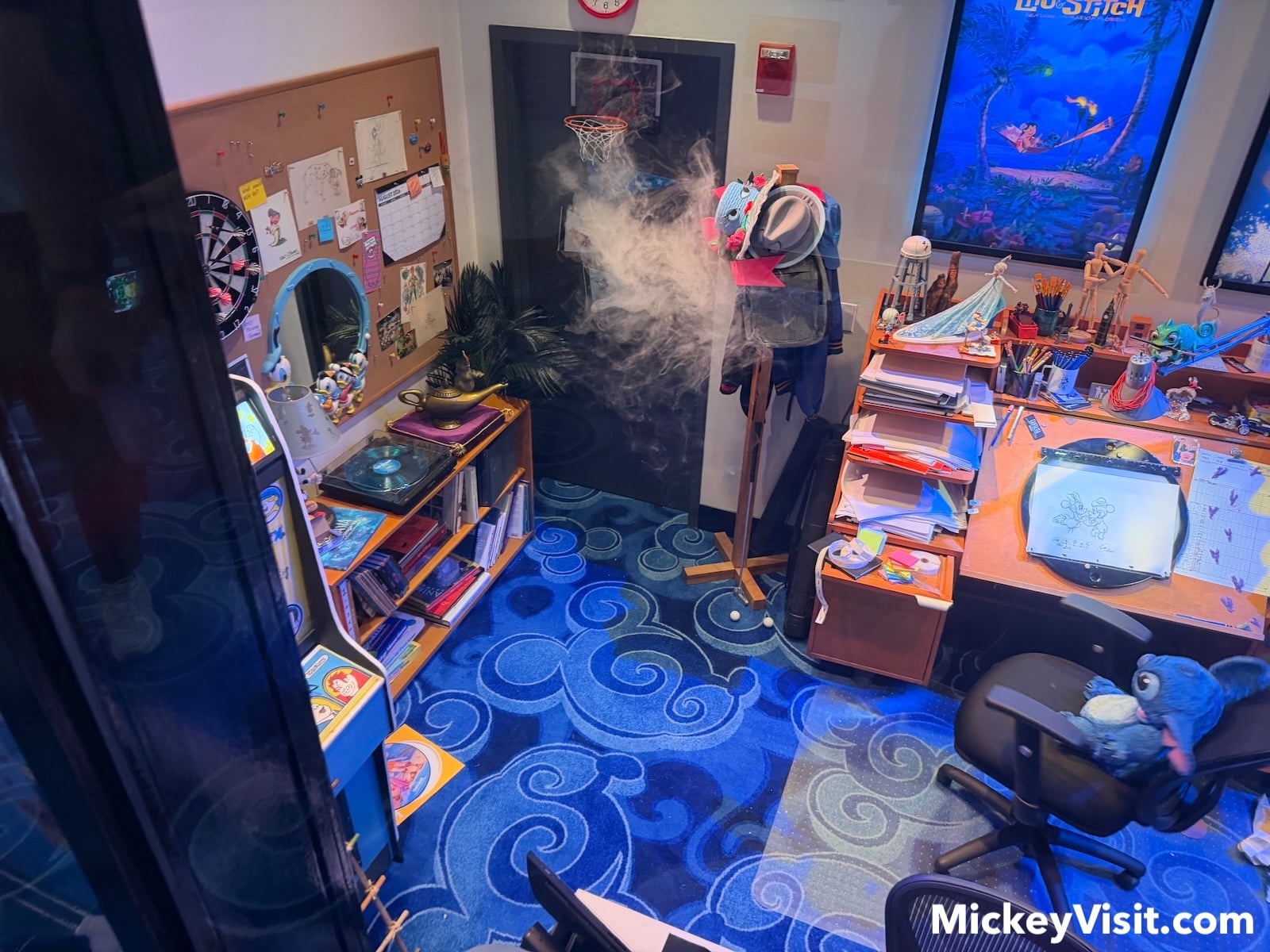 Stitch in animator's office with Disney memorabilia