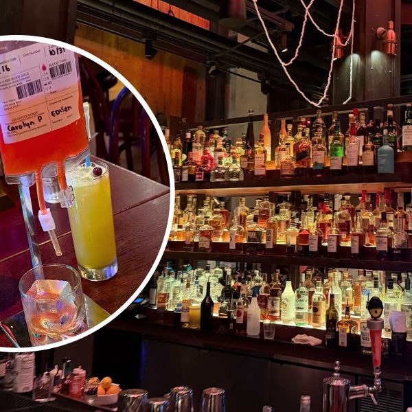 Drinks on table and alcohol on shelf
