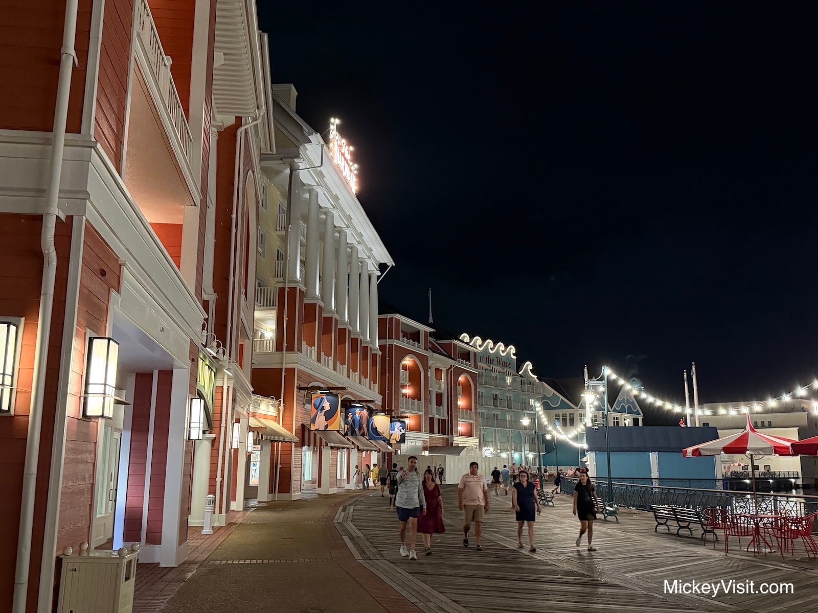 Shops along Disney's BoardWalk at night.