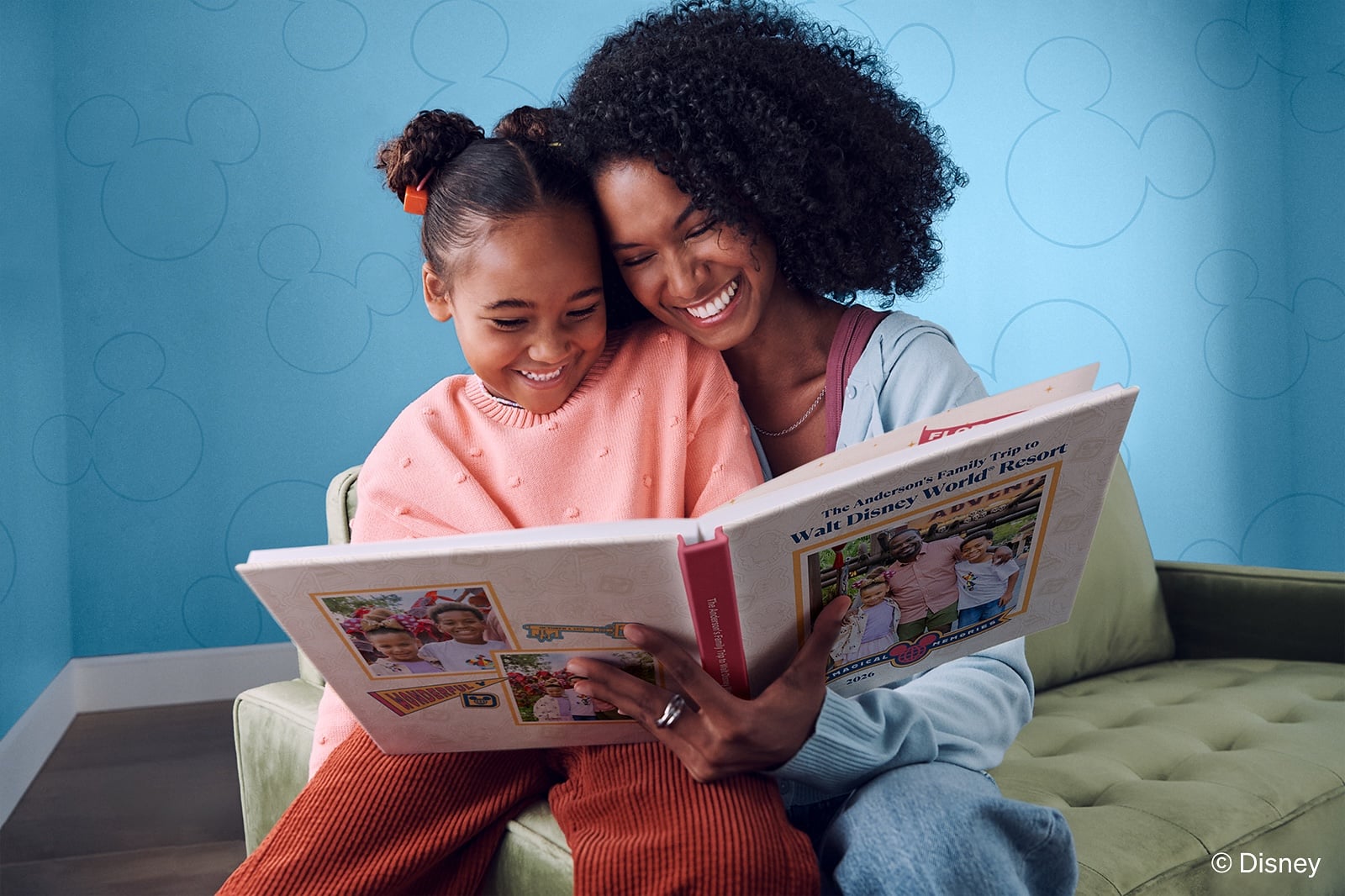 Daughter and mom smiling with photo book